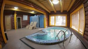 a jacuzzi tub in the middle of a room at Zatyshok in Svalyava