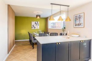 a kitchen and dining room with a table and chairs at Newly refurb 3 bed with parking in Stockton-on-Tees