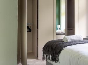 a bedroom with a bed and a mirror at Stock Street Apartment in Paisley +23 photos