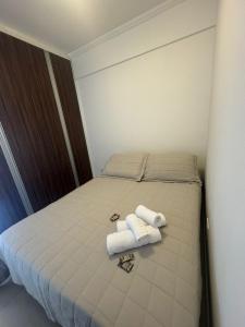 Ένα ή περισσότερα κρεβάτια σε δωμάτιο στο Apartamentos Liberdade São Paulo Center