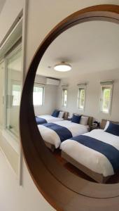 Rúm í herbergi á Villa Yukuru Ishigaki - ビーチ付きヴィラ
