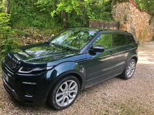 a green car parked on the side of a road at Chipping Campden - Cotswolds private house with garden in Chipping Campden