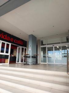 a mall with a table in the middle of a building at 404 Horizon Bay in Bloubergstrand +15 photos