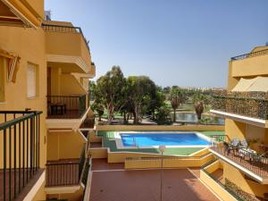 a view from the balcony of a building with a swimming pool at Apartamento Golf in Roquetas de Mar