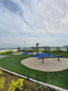 a park with a playground with a swing at DK Impian Studio Subang Airport in Shah Alam +8 photos