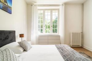 Postel nebo postele na pokoji v ubytování Domaine des rives d'Ormoy - Carré Bourbon