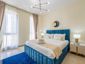 En eller flere senge i et værelse på Downtown Luxury Living -1BR-Standpoint Tower A