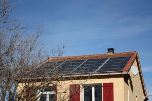 a roof of a house with solar panels on it at À l'ombre du mûrier in Blauvac
