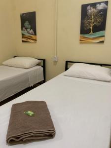 Un pat sau paturi într-o cameră la Pousada Quinzitão - O seu local de descanso!