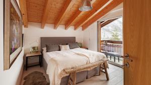 Postel nebo postele na pokoji v ubytování Casa delle Stelle by Zermatt Premium Apartments