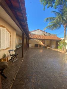 an outside view of a house with a patio at Quarto cápsula in Saquarema