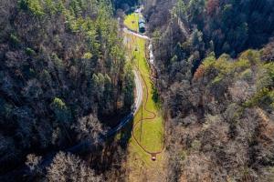 an aerial view of a road in a forest at Attitude Adjustment by Eden Crest in Sevierville