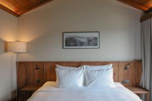 Voodi või voodid majutusasutuse HLS Dalat Lodge toas