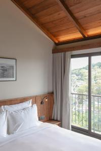 Voodi või voodid majutusasutuse HLS Dalat Lodge toas