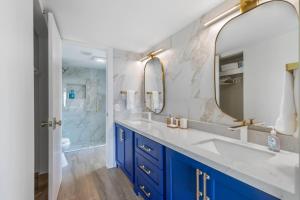 a bathroom with a large sink and a mirror at Saida II Beachfront Oasis in South Padre Island +20 photos