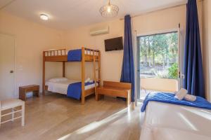 Postel nebo postele na pokoji v ubytování Primavera Hotel
