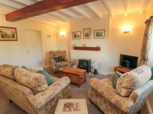 Posezení v ubytování Lilac Cottage