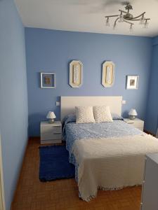 Кровать или кровати в номере Piso FOFI, junto a la playa