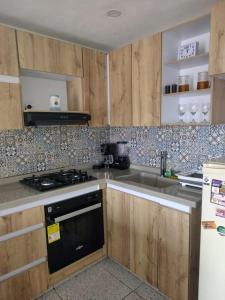 Nhà bếp/bếp nhỏ tại Apartamento acogedor para vacacionar o de trabajo