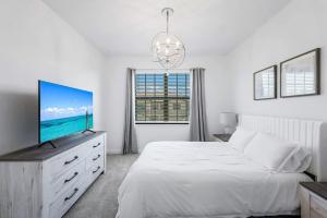 Ένα ή περισσότερα κρεβάτια σε δωμάτιο στο Paradise in Fort Myers FL +40 φωτογραφίες