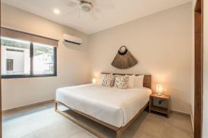 Ένα ή περισσότερα κρεβάτια σε δωμάτιο στο Selva Terra Sol Beach Club Access +16 φωτογραφίες