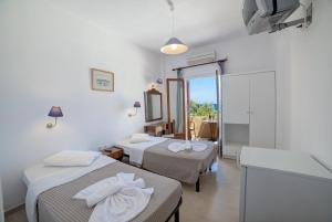 Llit o llits en una habitació de Nostos Beach