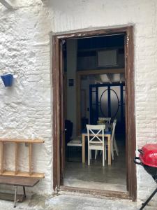 an open door to a dining room with a table at La Auténtica in Valencia