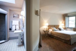 A bed or beds in a room at B&B Pieve Degli Artisti