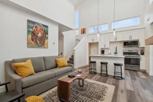 a living room with a couch and a table at Quarry A21 in Whitefish