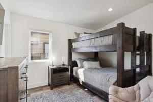 a bedroom with a large wooden bunk bed at Quarry A21 in Whitefish +36 photos