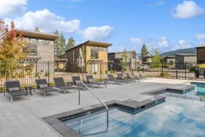 a patio with chairs and a swimming pool at Quarry A21 in Whitefish