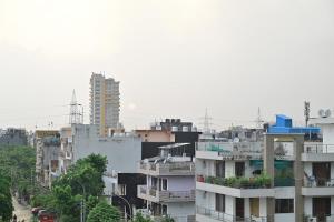 a view of a city with buildings and trees at the indigo premium in Noida