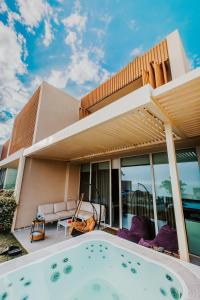 a house with a swimming pool in front of it at Villa Splendid Palase in Himare