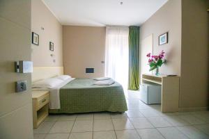 Postel nebo postele na pokoji v ubytování Di Matteo Hotel