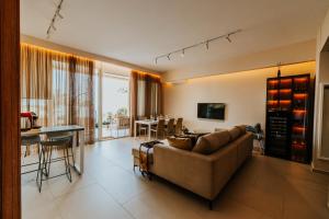 a living room with a couch and a table at Villa Splendid Palase in Himare