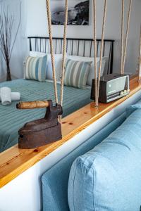 a swing in a bedroom with two beds at Lalaros Apartment in Glóssa