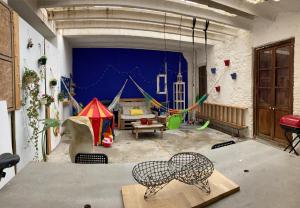 a living room with a play room with swings at La Auténtica in Valencia