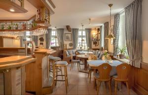a restaurant with tables and chairs in a room at Hotel Samson in Beckum