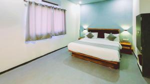 Nova Hotel New Crossroad客房内的一张或多张床位