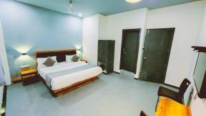 Nova Hotel New Crossroad客房内的一张或多张床位