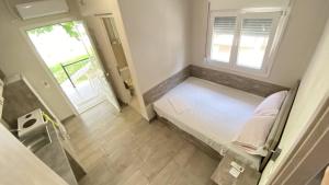 Postel nebo postele na pokoji v ubytování Kalouda Rooms