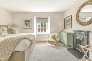 Postel nebo postele na pokoji v ubytování The Stone House