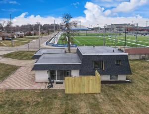 a house with a wooden fence in a field at Game Day Getaway-Play Relax Make Memories in Canton