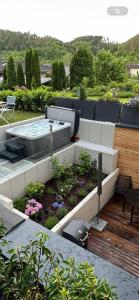 a garden with a hot tub on top of a building at Ferienwohnung Sophie in Schleiden
