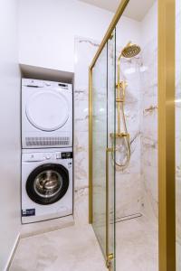 a washer and dryer in a bathroom with a shower at Luxury App PALACE OLD TOWN& Studio Green Melody with TERACCE in Split