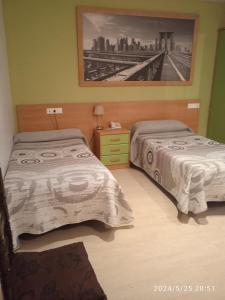 Cama o camas de una habitación en Hotel Restaurante Caracho