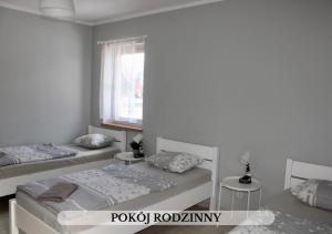 Postel nebo postele na pokoji v ubytování Michałówka Pokoje i Domki