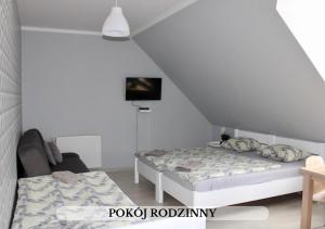 Voodi või voodid majutusasutuse Michałówka Pokoje i Domki toas +37 fotot