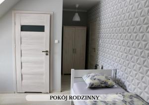 Postel nebo postele na pokoji v ubytování Michałówka Pokoje i Domki