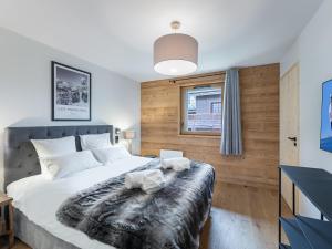 Katil atau katil-katil dalam bilik di Appartement Saint-Martin-de-Belleville, 5 pièces, 8 personnes - FR-1-570-44